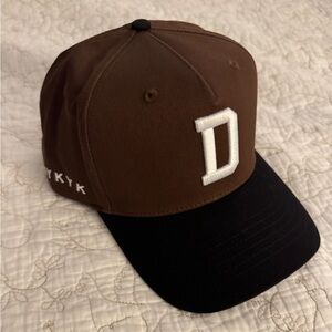 Brown and Black Cap with 'D' Logo